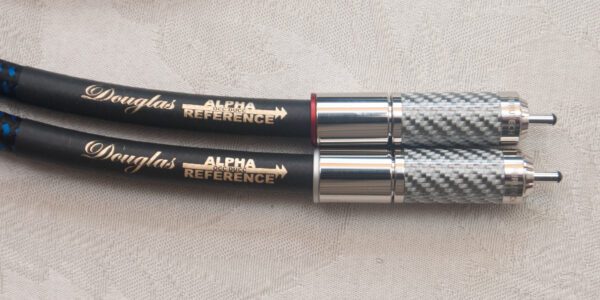 Two pens with a silver and black pen holder.